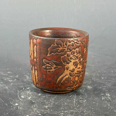 Red batik patterned tea cup